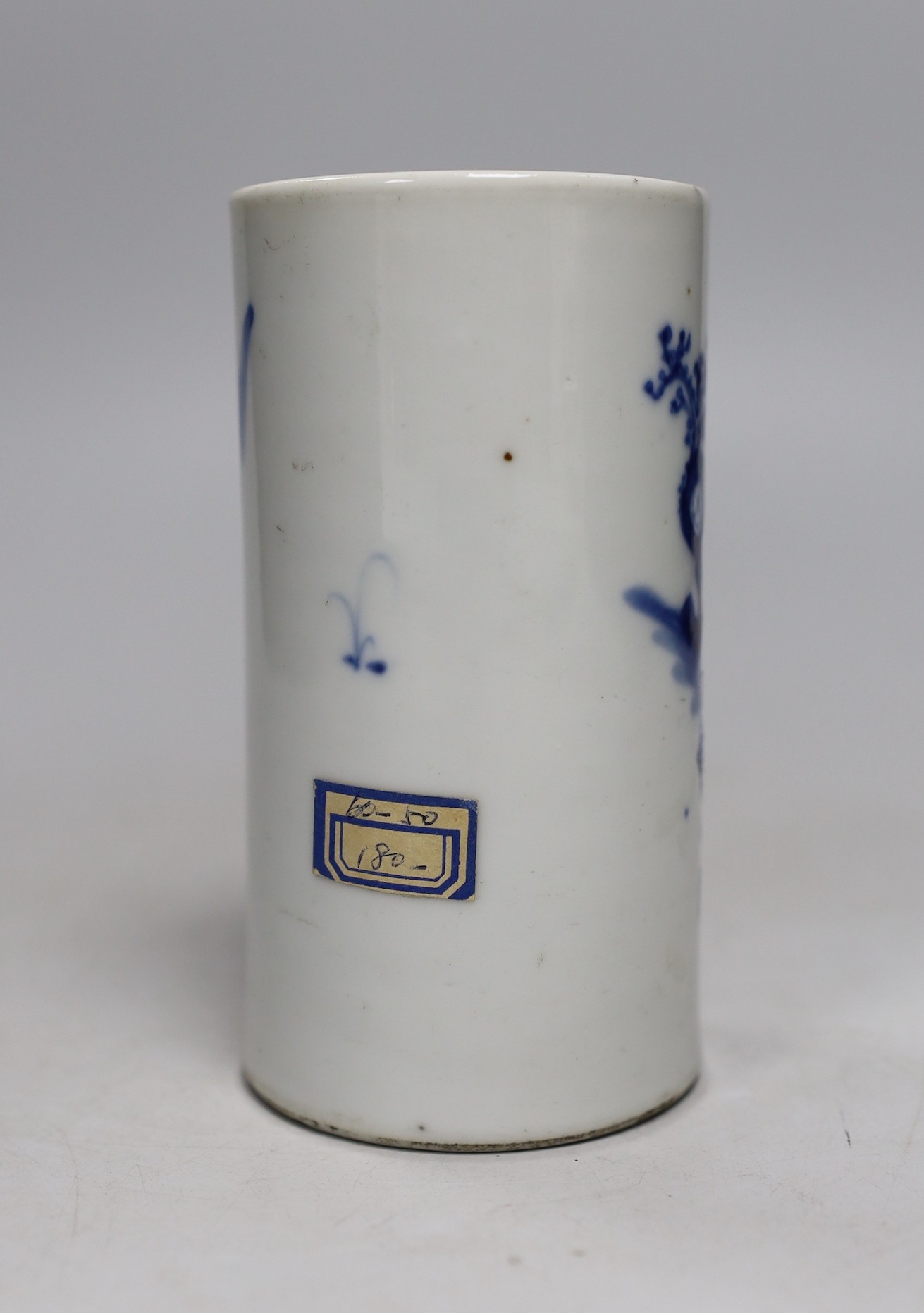 A late 19th century Chinese blue and white brushpot. 13cm tall